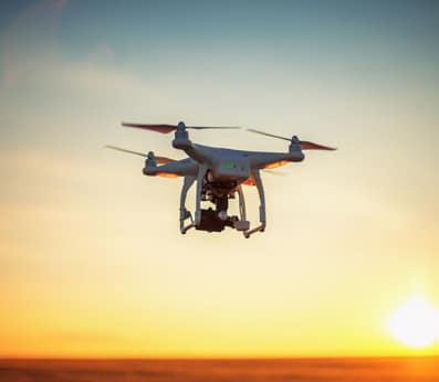 Drone Flying at Sunset - Global Drone Solutions